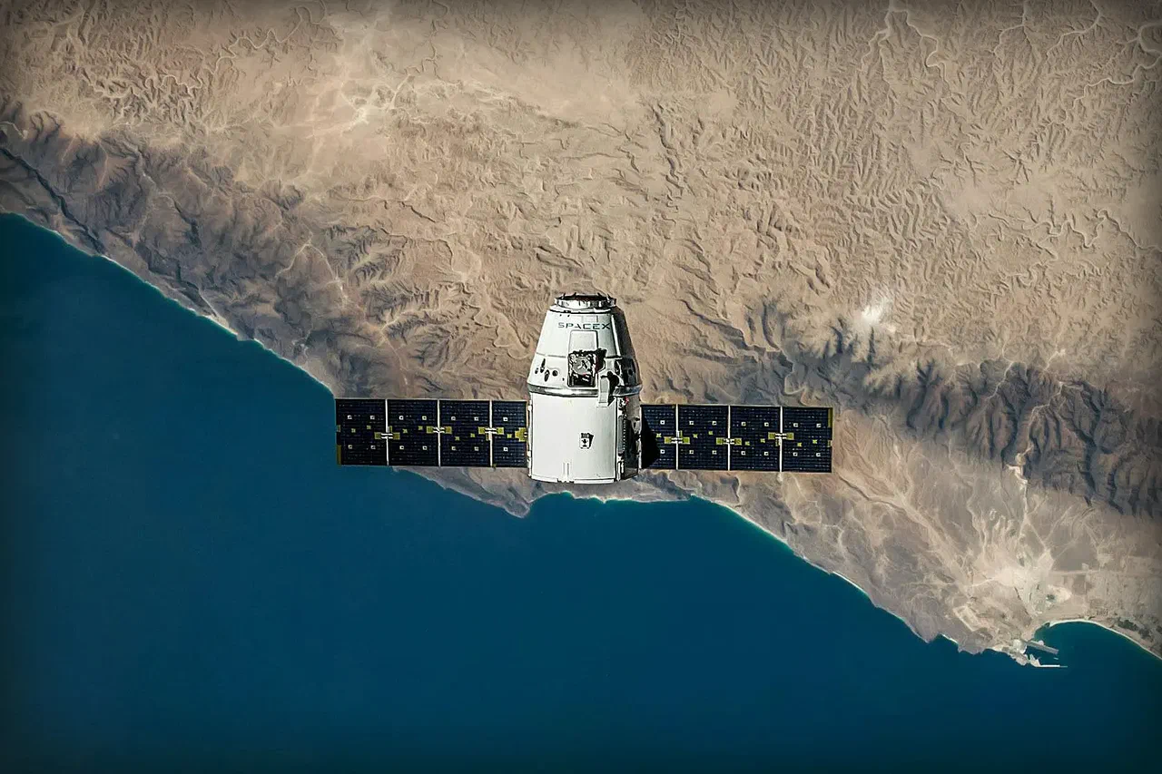Aerial view of satellite flying over land